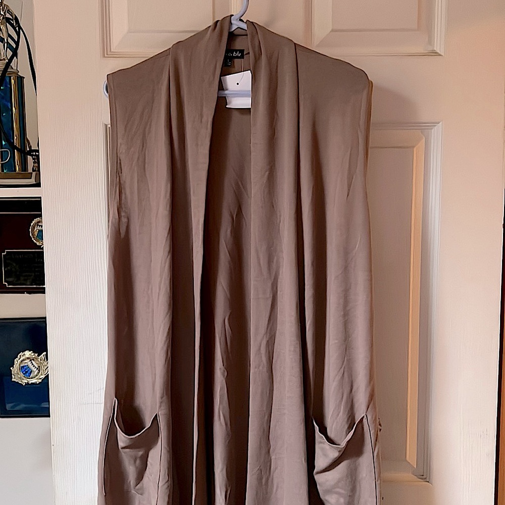Never worn, long sleeveless mocha cardigan